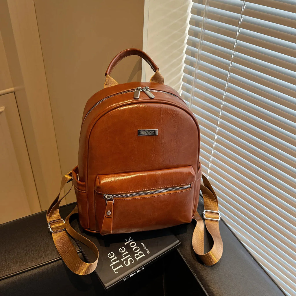 Ladies travel backpack in urban simplicity style, soft PU material, waterproof, with sandwich pocket