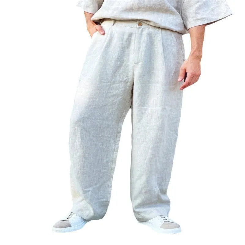 Men's loose high-waist linen jogger pants in grey, showing straight-leg casual style.