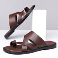 Simple Leisure Seaside Beach Slippers in dark brown with rubber sole, side view on sand