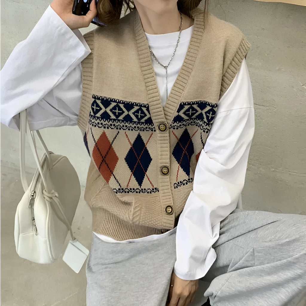 Khaki diamond plaid sleeveless cardigan on a hanger, showing loose fit and open front.