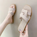 Women's PVC cross-strap flip-flop sandals in milky white, shown for home casual wear.