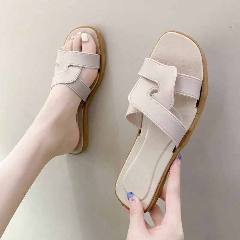 Women's PVC cross-strap flip-flop sandals in milky white, shown for home casual wear.