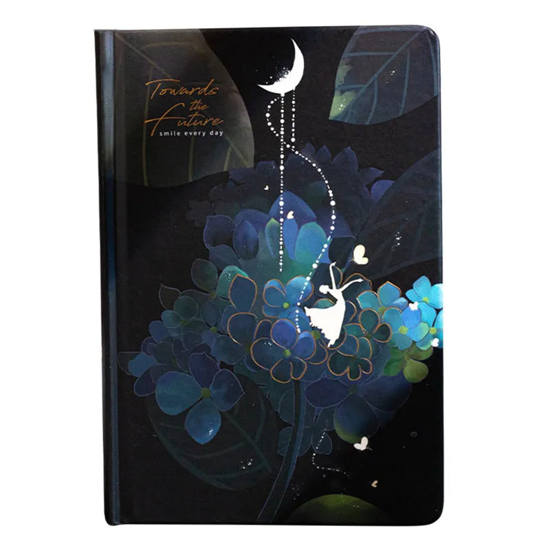 A5 notebook with luminous cover open to show colour illustration inside, in deep blue colour option.