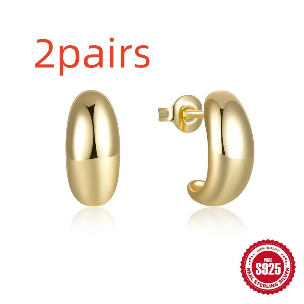 C-shaped geometric stud earrings in 925 sterling silver with glossy gold electroplated finish