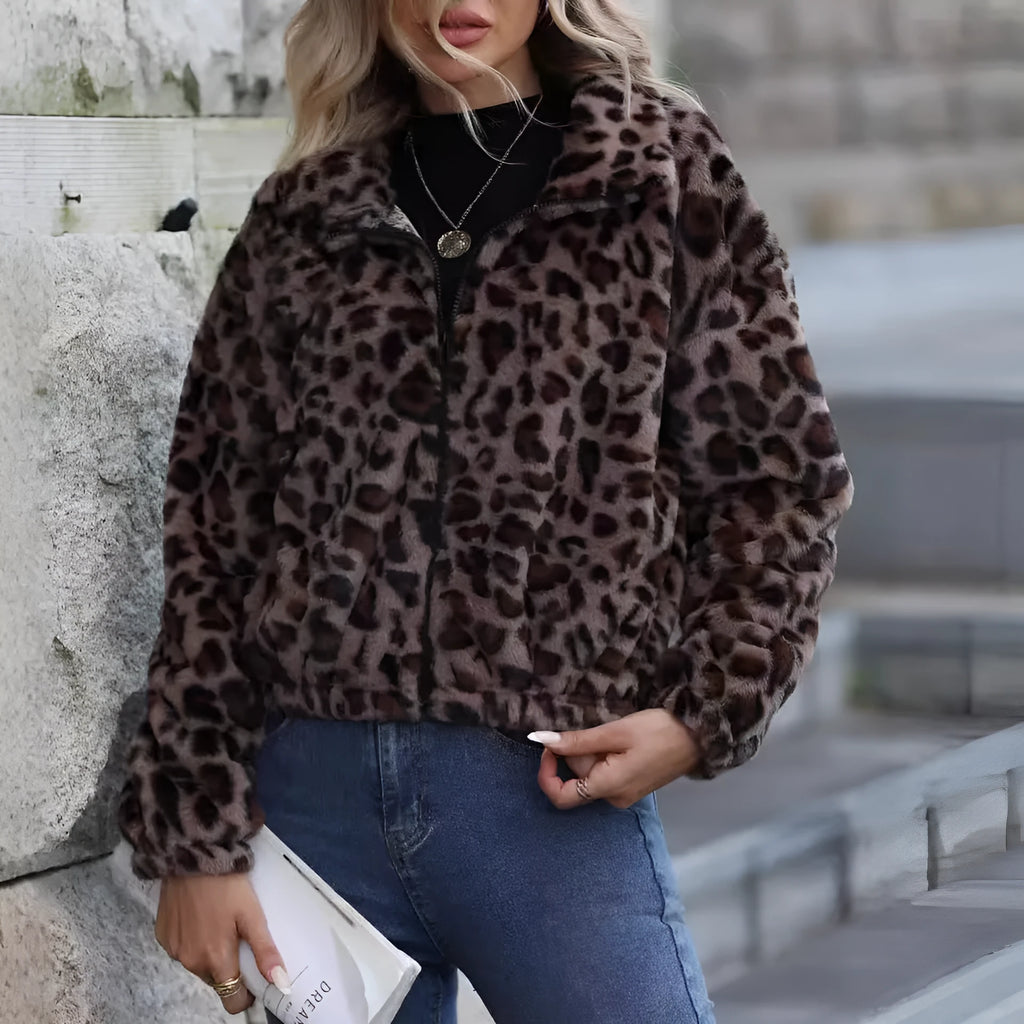 Women's loose fit leopard print plush coat with long raglan sleeves and a full zip.