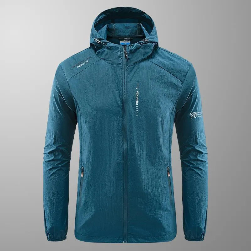 Man wearing a lightweight grey hooded nylon jacket for summer sun protection