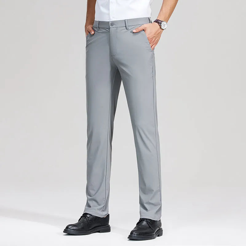 Pair of men's summer ice silk straight-leg suit trousers in solid colour on white background