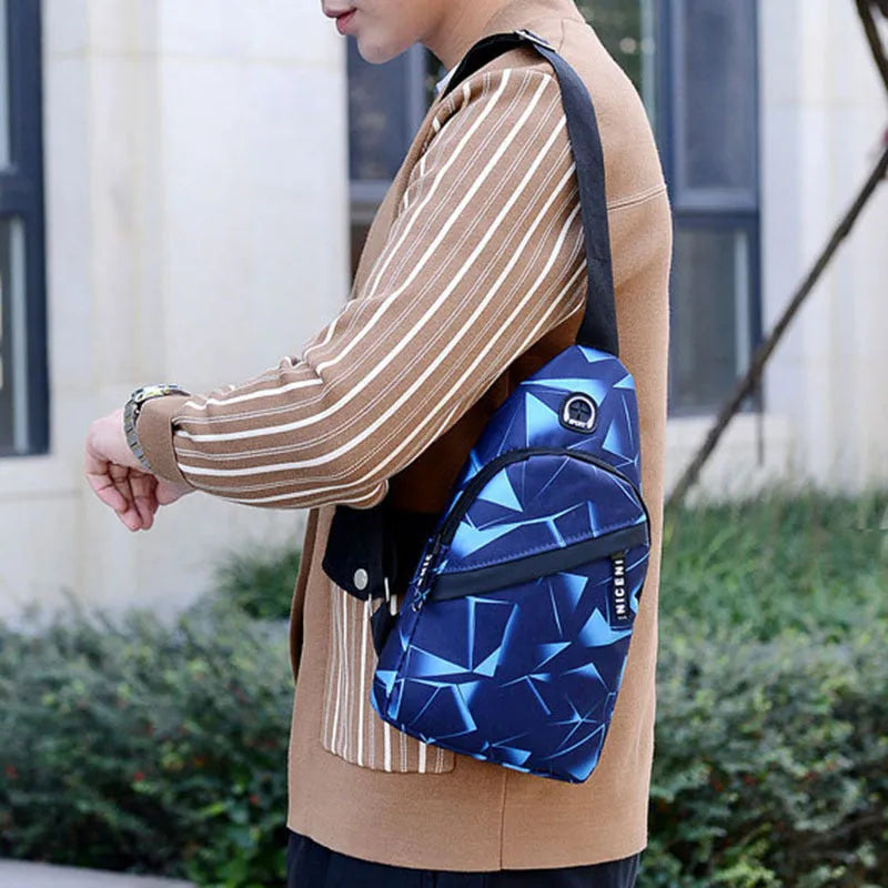 A blue print sling chest bag for men with an earphone hole, shown in a square vertical crossbody style.