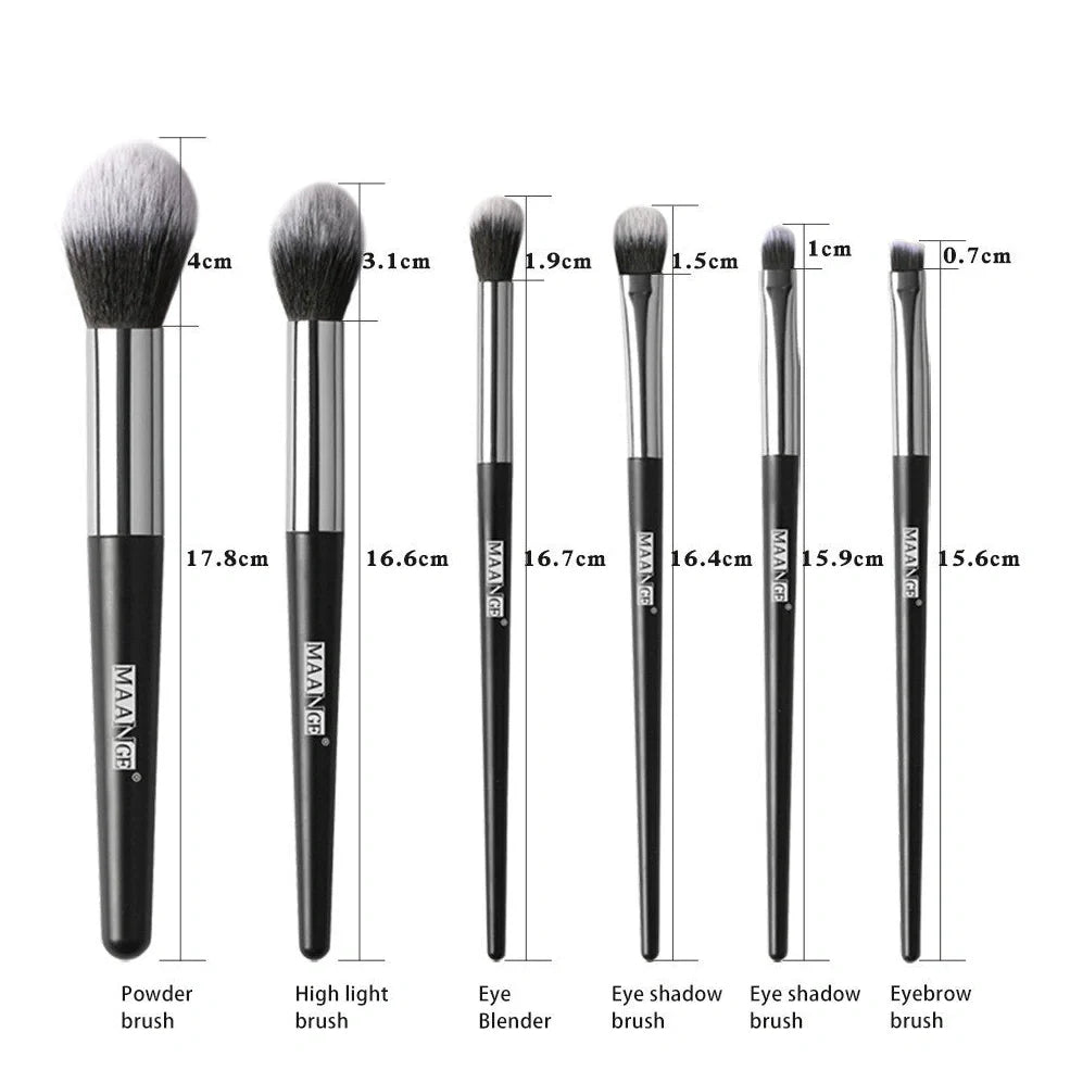 Six makeup brushes with black synthetic bristles and natural wood handles measuring 15cm