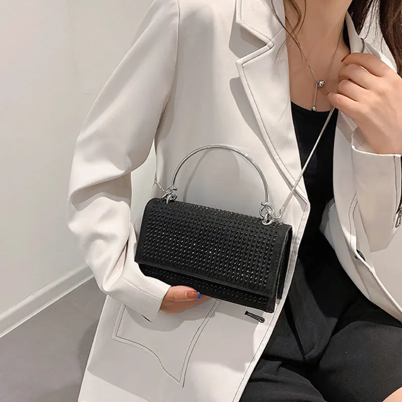 Small square chain crossbody bag for women with rhinestones in silver and black, PU construction with crossbody strap