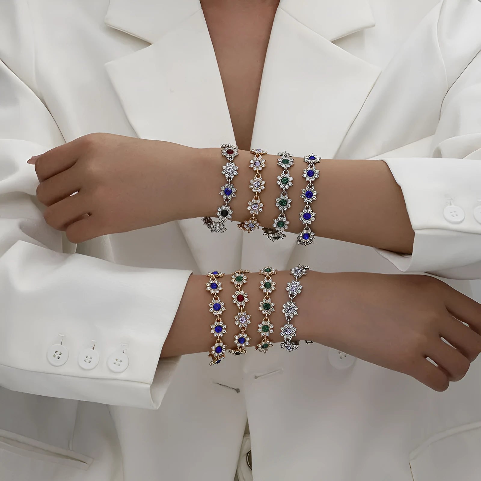 Electroplated zinc alloy bracelet with flower-shaped design and coloured gem elements in metallic finish