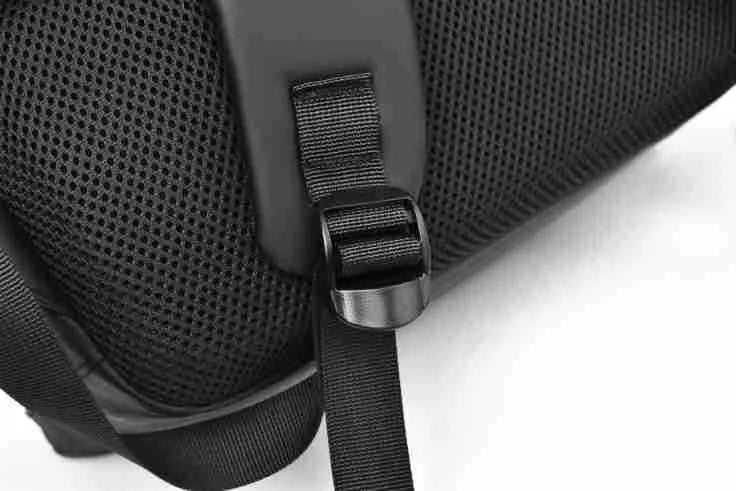 Men's large black waterproof PU backpack showing sewing thread detail and separate computer bag.