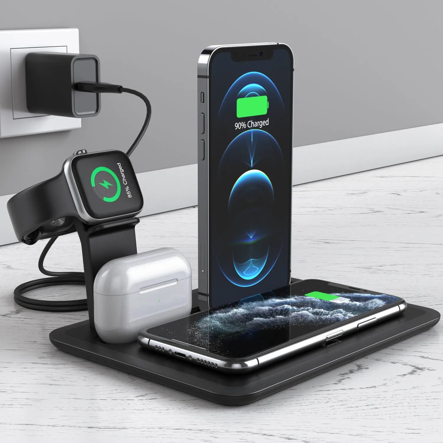 Black wireless charging bracket holding an iPhone vertically, with AirPods and an Apple Watch on its base.