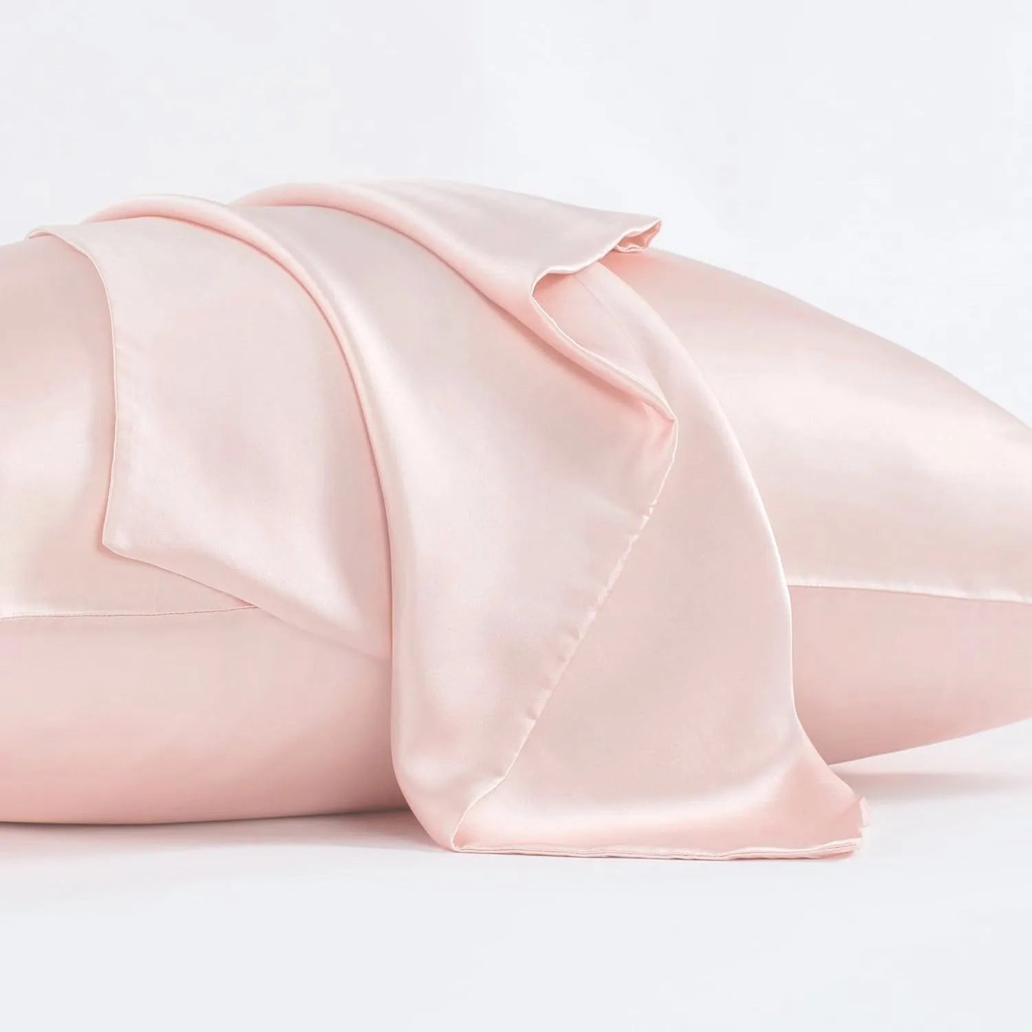 Dark grey mulberry silk pillowcase with envelope closure, shown in a modern bedroom setting.
