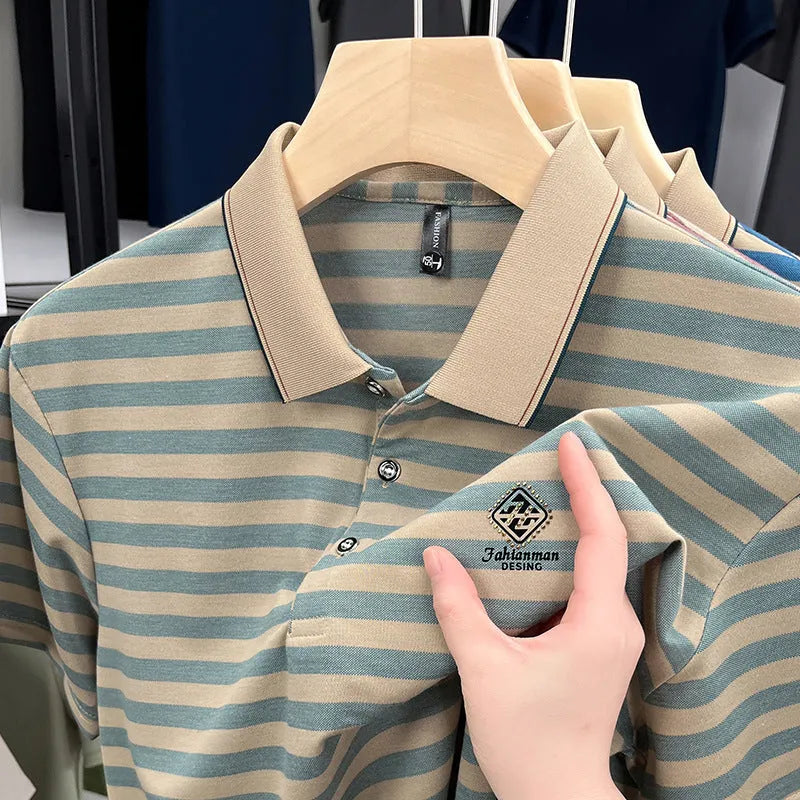A man wearing a red, blue, or green striped short sleeve casual shirt with a mosaic pattern detail.