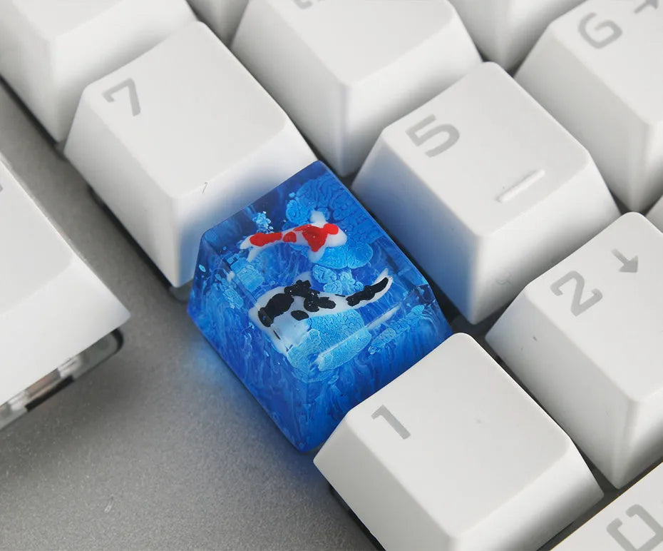 Blue scenic koi fish resin keycaps for Cherry MX mechanical keyboards showing spacebar and individual keys