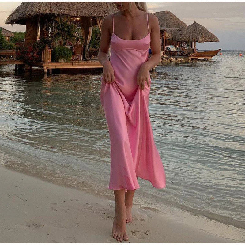 Elegant sleeveless slip maxi dress in pink with backless design and figure-flattering silhouette