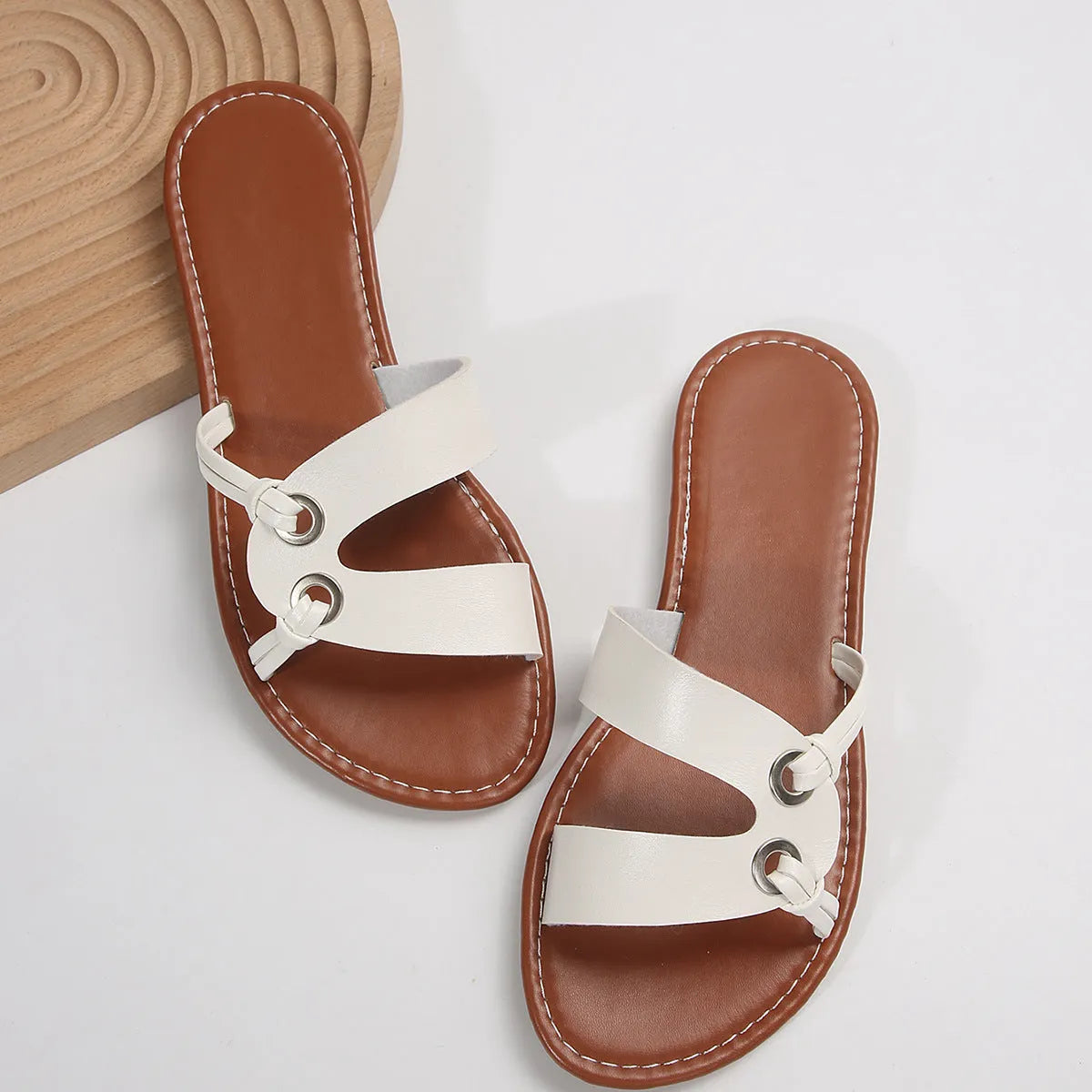 Women's round toe flat sandals in light brown with PU upper and rubber sole