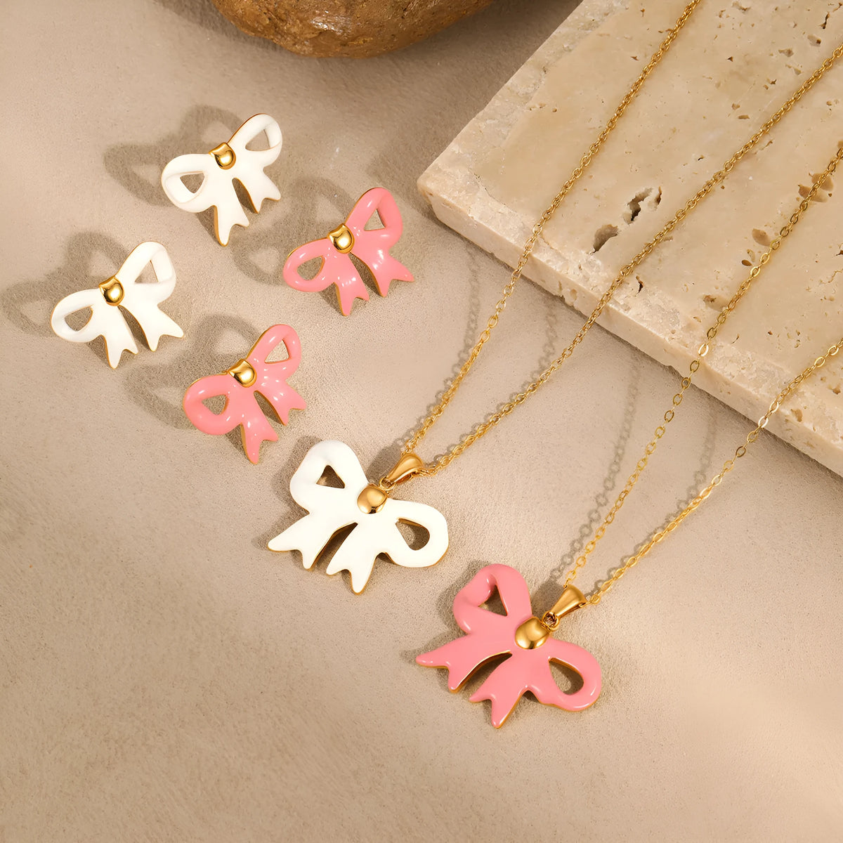 Bowknot stainless steel pendant necklace on white background, adjustable 41-50cm chain, 18K gold-tone finish