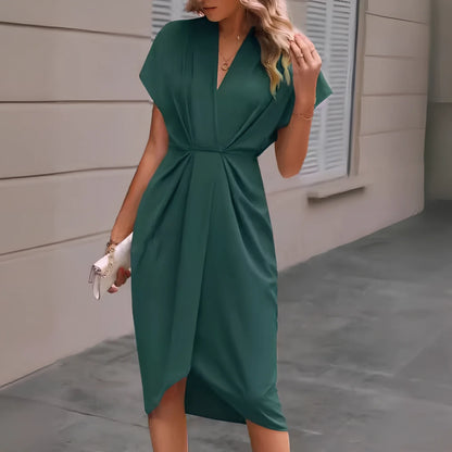 Black V-neck batwing sleeve polyester dress with pleated A-line skirt, mid-length 94cm in size M, showing shrug sleeves and solid colour fabric