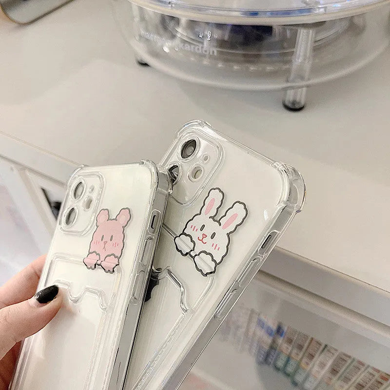 Clear cartoon-design iPhone case with a built-in card holder slot on the back.