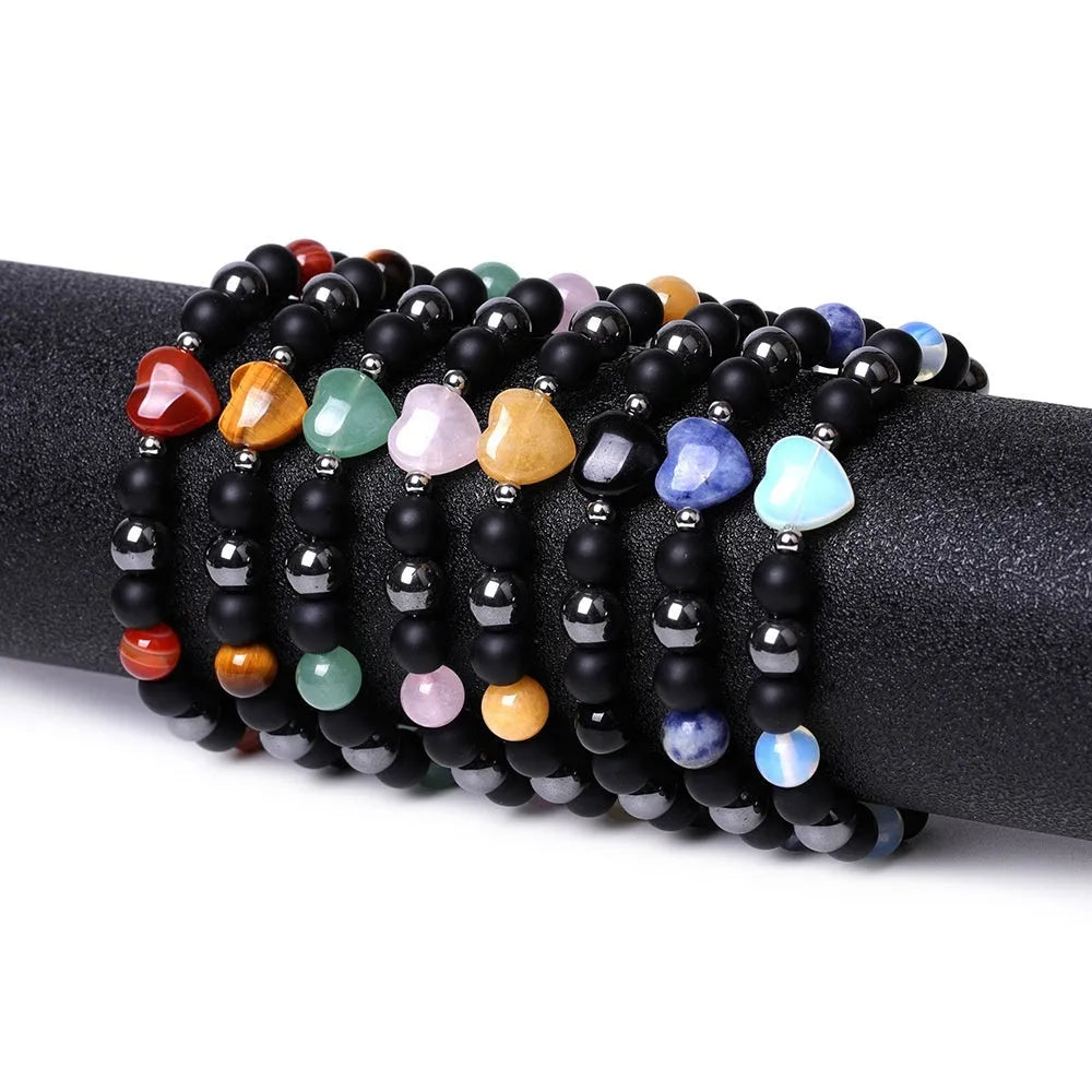 Hand-cut geometric peach heart stone bracelet with moon and planet decorative elements in eight colour options
