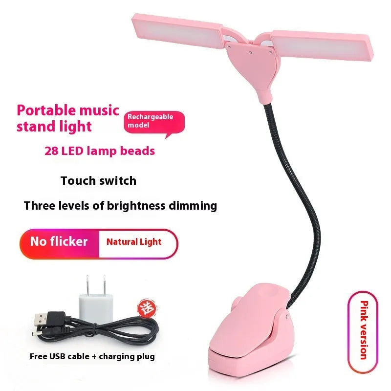 Black plastic music stand lamp with 28 LED lights and a USB charging cable on a music stand.