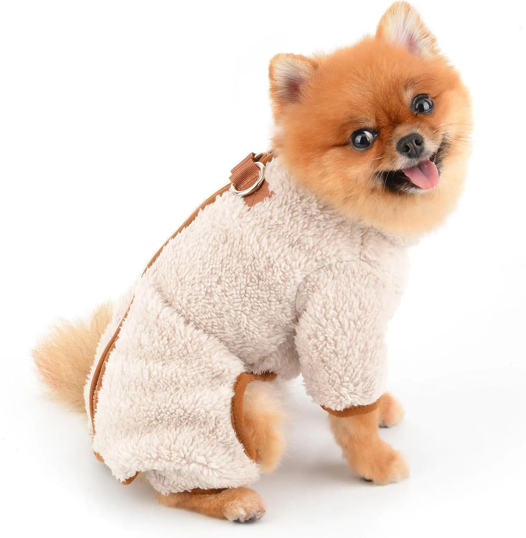 Green plush fleece dog jumpsuit on a small dog, showing zipper back and leg coverage.