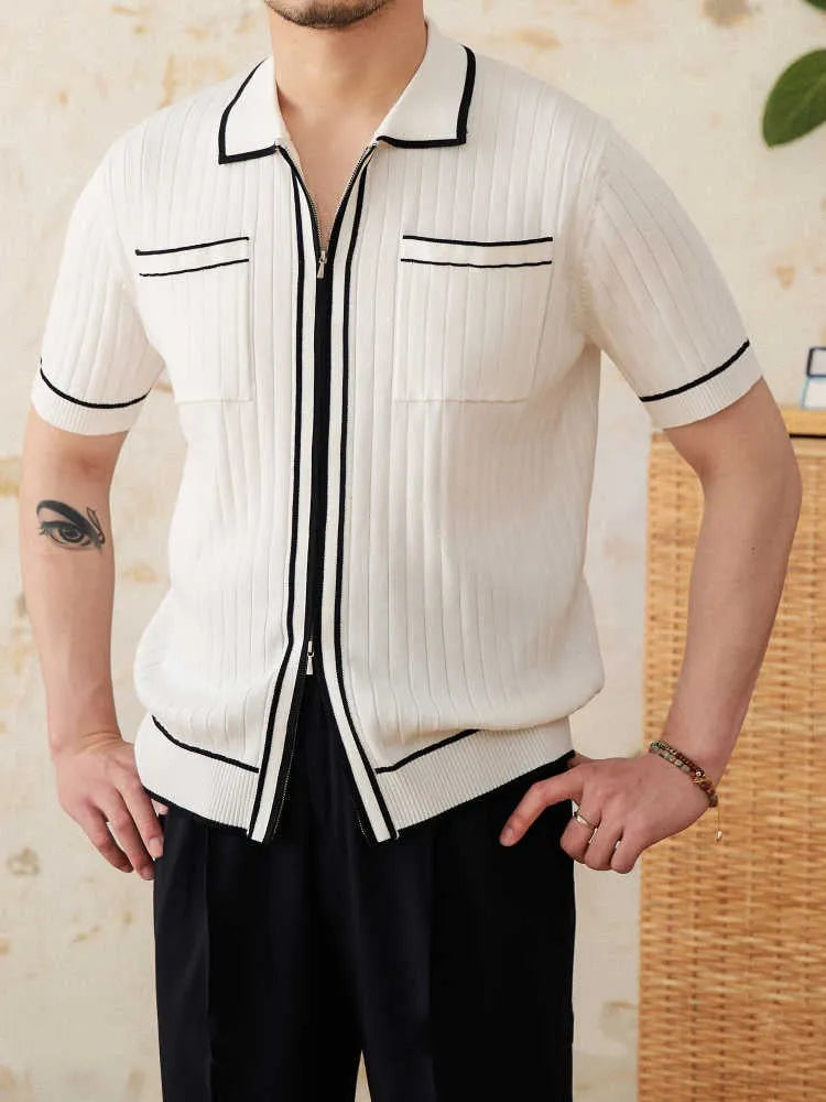 Man's slim-fit black knitted polo shirt with a lapel collar and short sleeves.