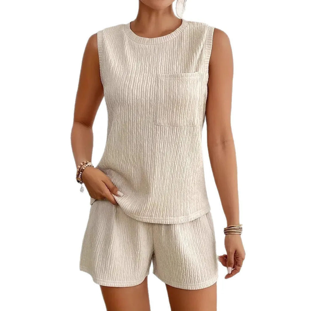 Apricot coloured women's sleeveless vest and elastic waist shorts loungewear set on a hanger.