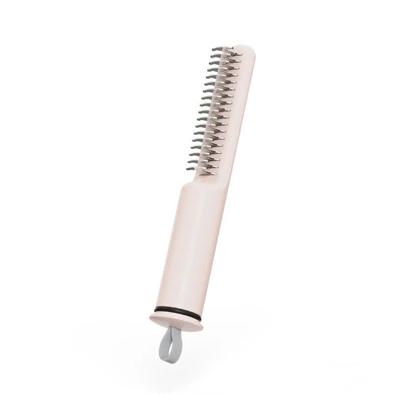 Stainless steel dog dematting comb with ergonomic handle on a pink background