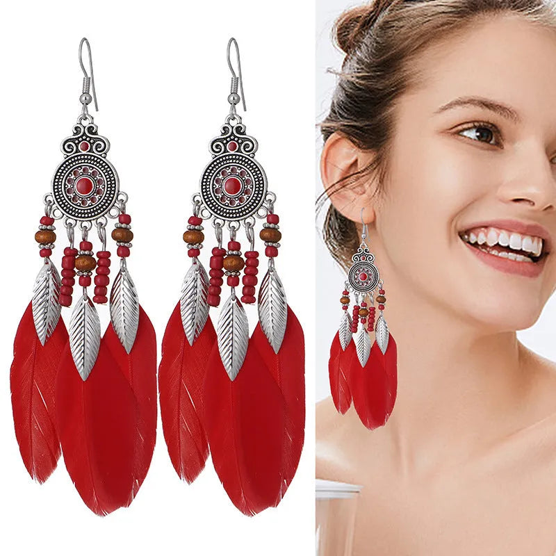 Bohemian feather drop earrings in leaf shape with pattern details, available in multiple electroplated colours.
