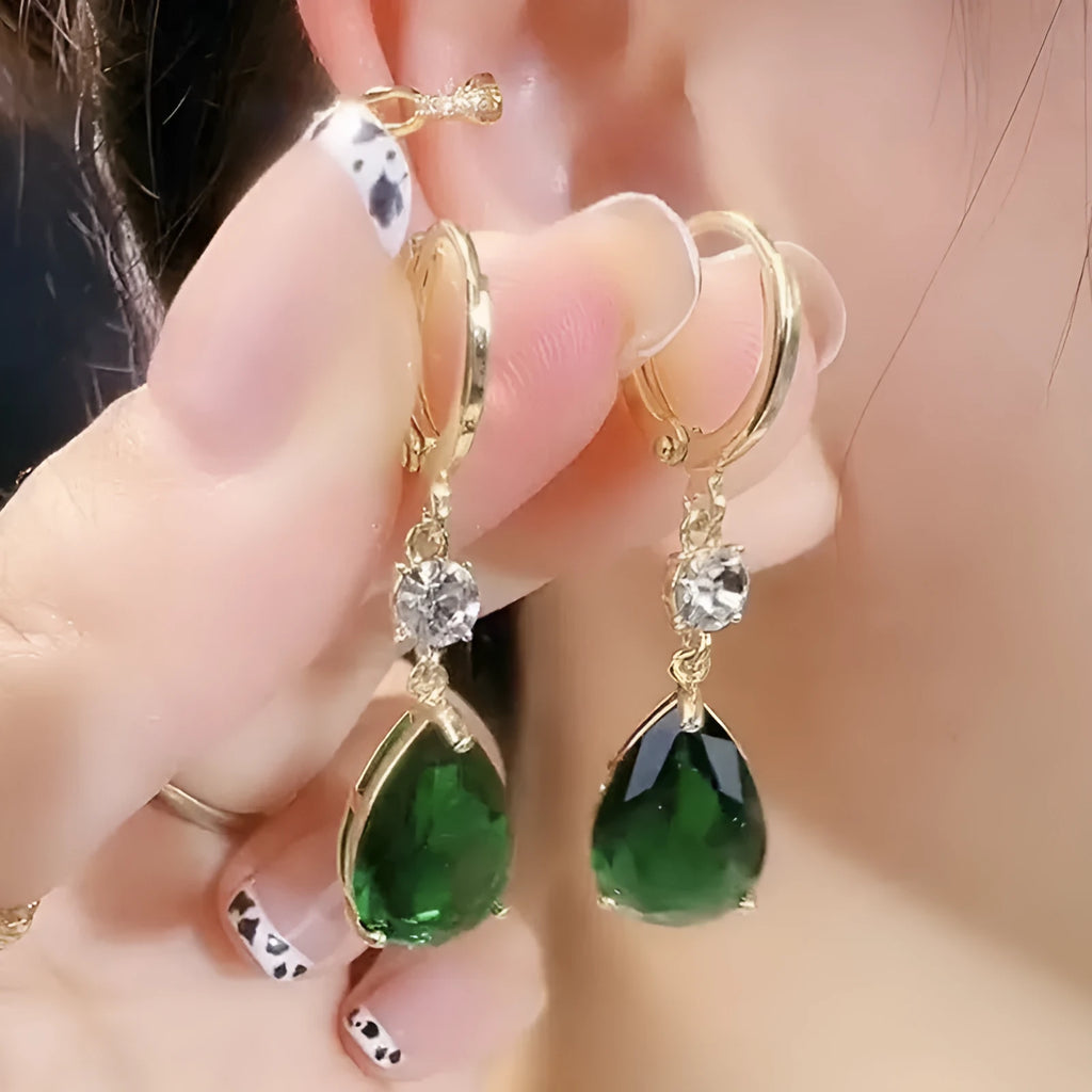Green geometric teardrop clip-on earrings with gold plating.