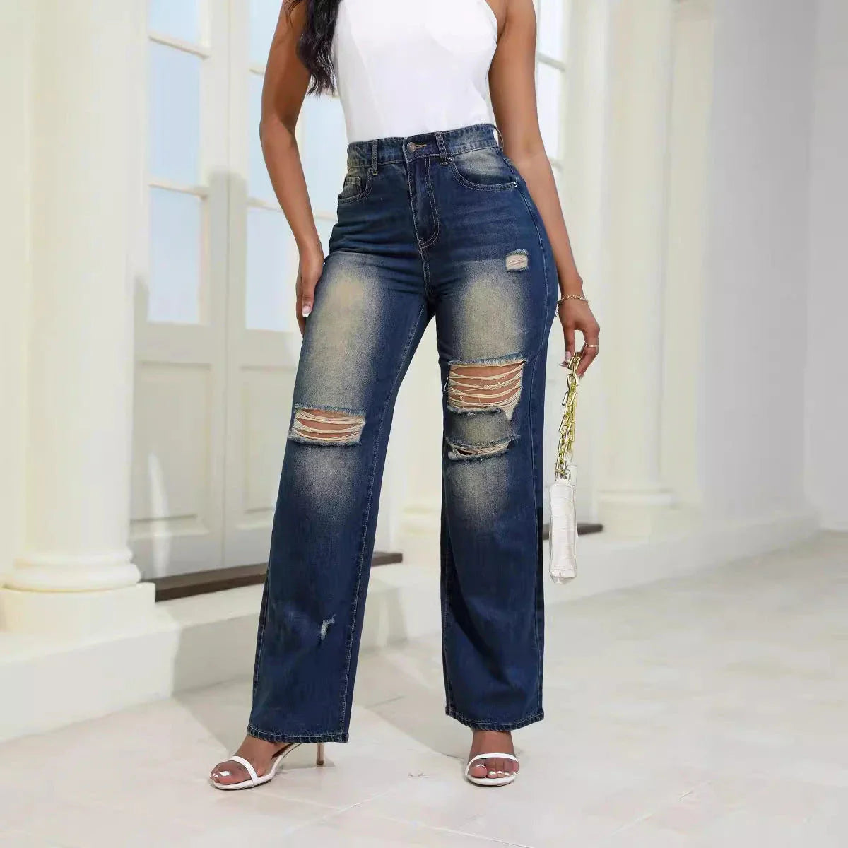 Fashionable high-waist ripped jeans with pockets, made from premium denim and artificial silk blend for comfort and style.