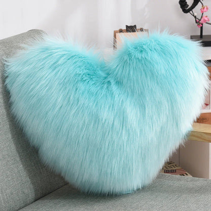 Plush heart-shaped throw pillows in various colors and styles for cozy sofa decor