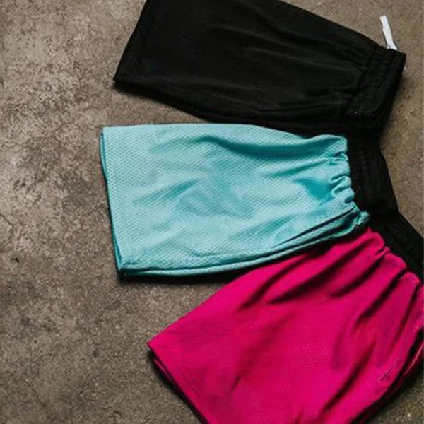 Men's solid colour mesh quick-drying running shorts in black, shown on a hanger.