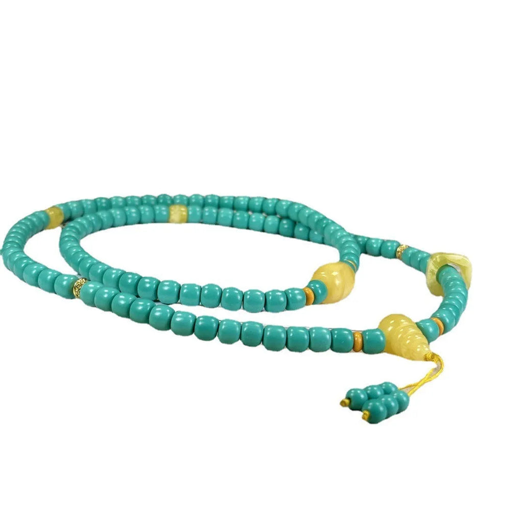 Turquoise mesh flower pendant on an adjustable ball bead necklace chain.
