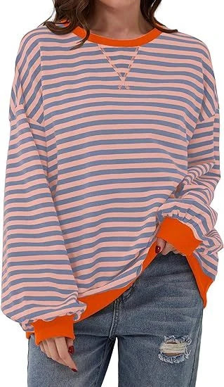 Striped sweatshirt in navy blue, pink, and orange with contrasting colours