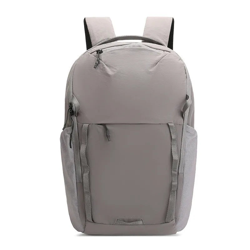 Solid-colour unisex backpack made from waterproof Taslan cloth with a curved shoulder strap.