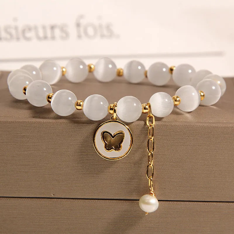 White cat's eye crystal bracelet with geometric design and Korean-style influences