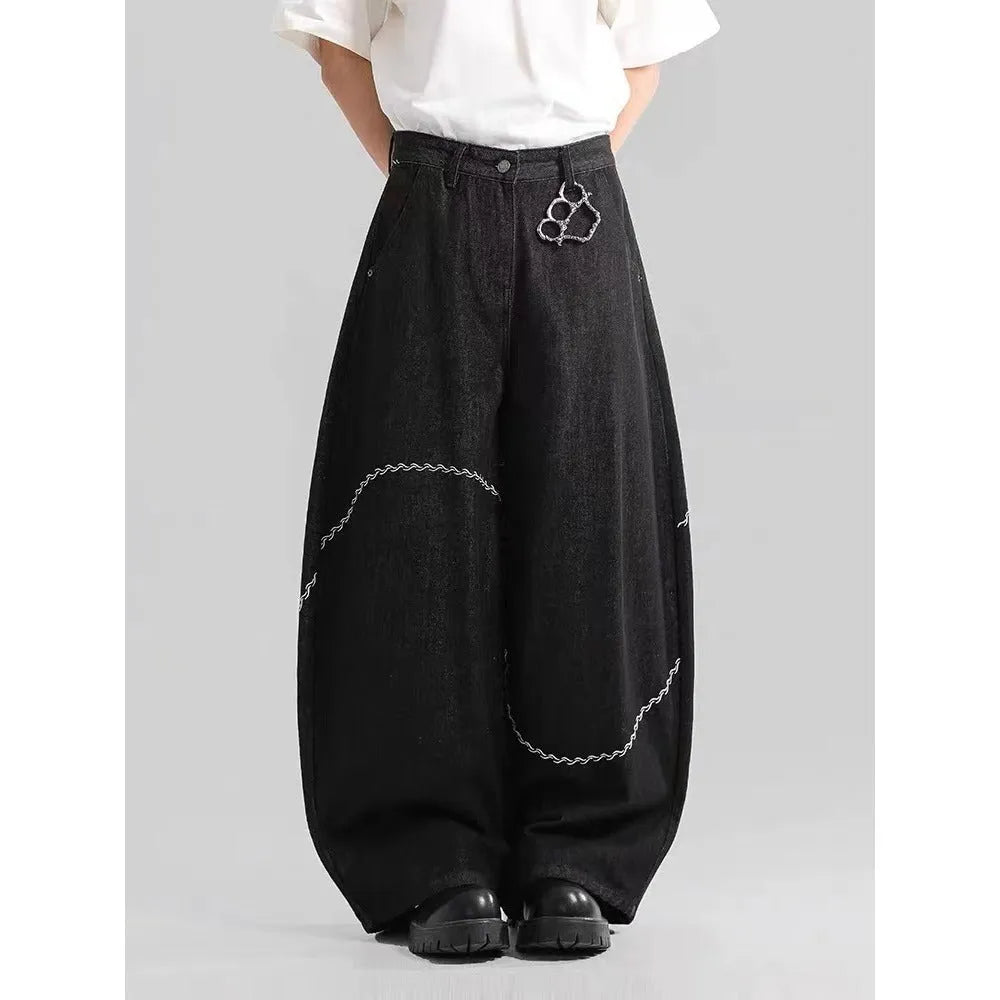 Black straight-leg polyester denim trousers with a zip fly and micro-elastic waistband.