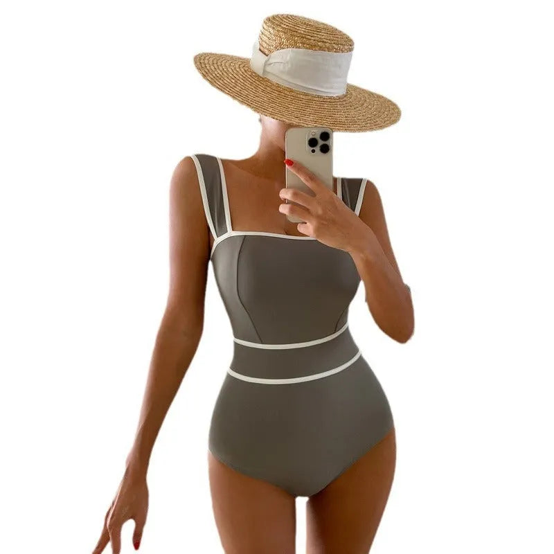 Women's one-piece swimsuit with lace-up back in nylon fabric available in black, grey, or white