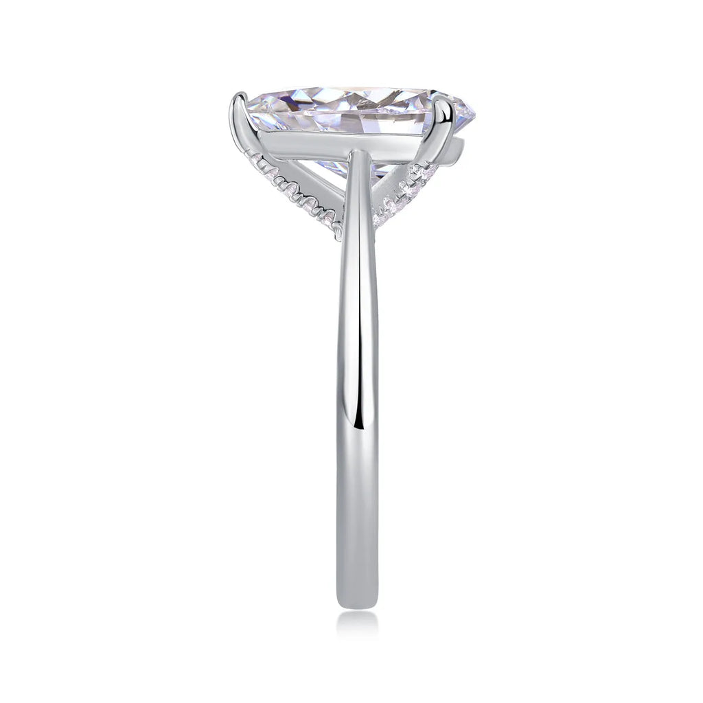 Heart-shaped pear-cut moissanite wedding ring set in S925 silver with platinum plating on white background