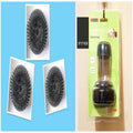 Kitchen cleaning brush with push-button soap dispenser and scrubber head.