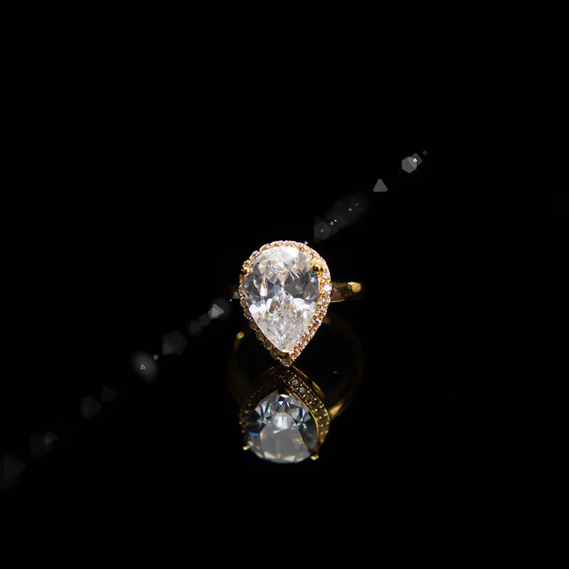Drop-shaped zircon non-fading three-piece jewellery set gold plated with mixed gem inlaid pendant in emerald gold colour on white background