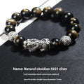 Men's geometric bracelet made of black obsidian and polished 999 sterling silver, showing its width and structured design.