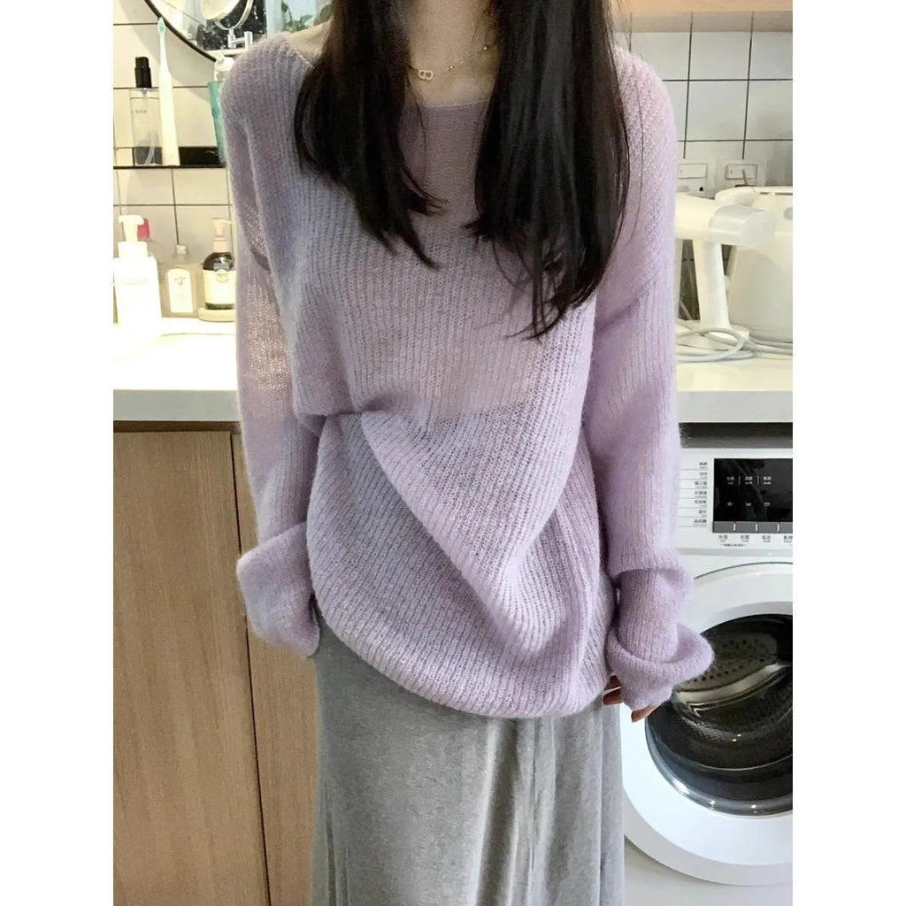 Purple women's sleeveless blouse with hollow out detail and princess sleeves, laid flat.
