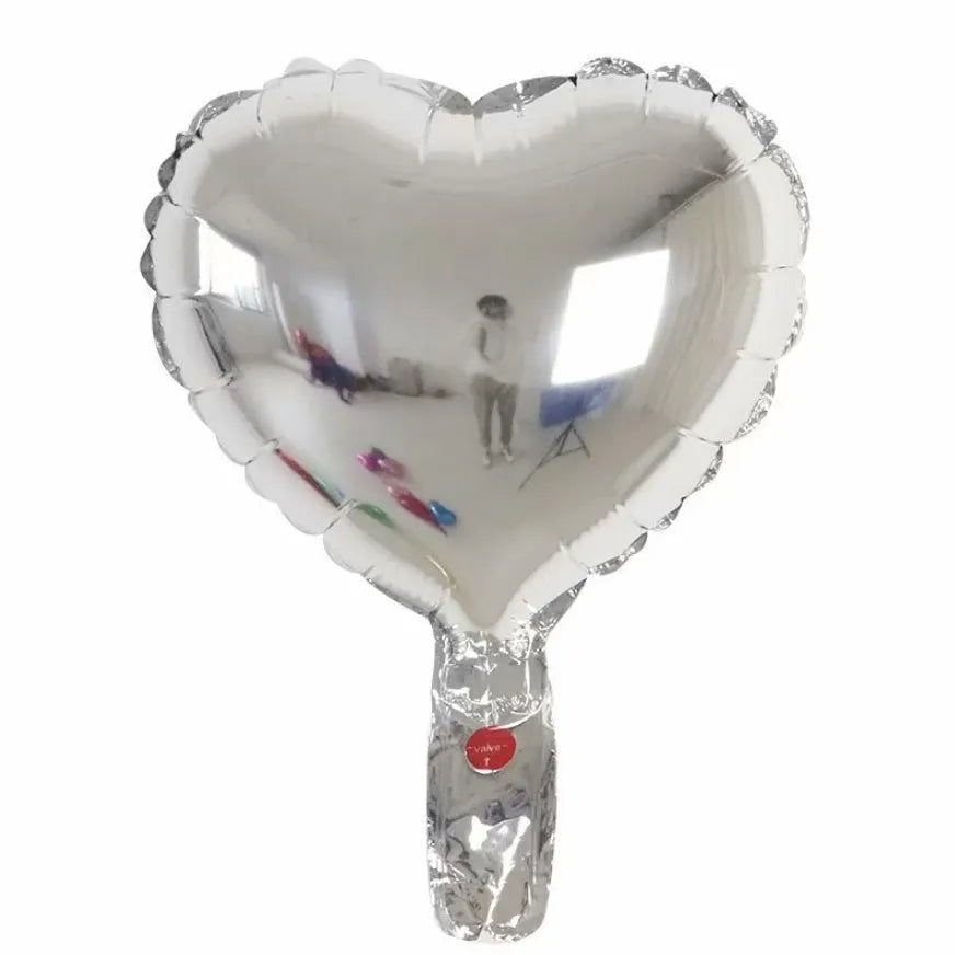 Five peach heart-shaped metallic aluminium balloons in assorted colours on a white background.