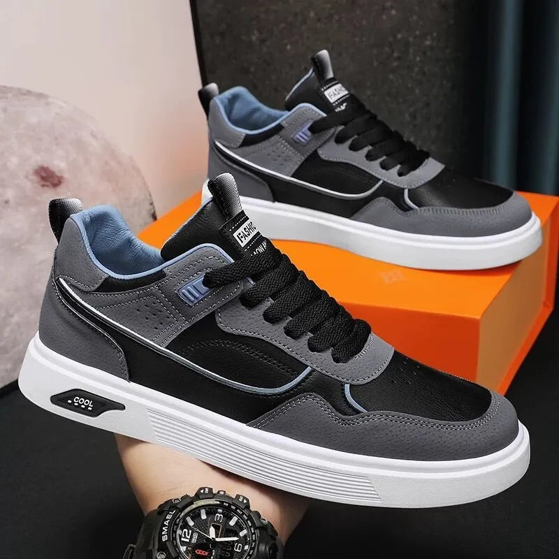 Men's low-top canvas sneakers in black with mesh lining and leather stitching detail.