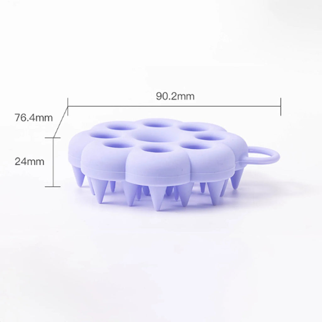Silicone pet grooming brush with ergonomic handle shown in multiple colours: blue, green, orange, pink, purple.